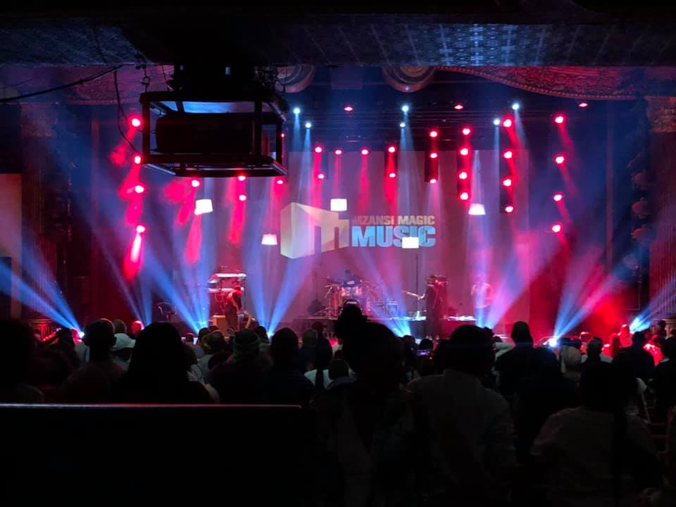 Dynamic lighting enhancing the atmosphere of a bespoke stage by Animate-Co.