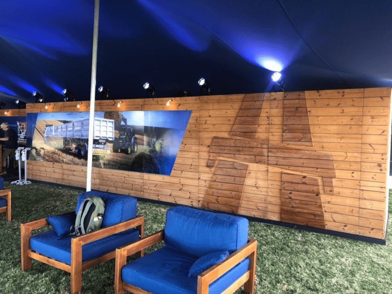 custom wooden exhibition booth with seating and feature wall built by exhibition stand builders Cape Town