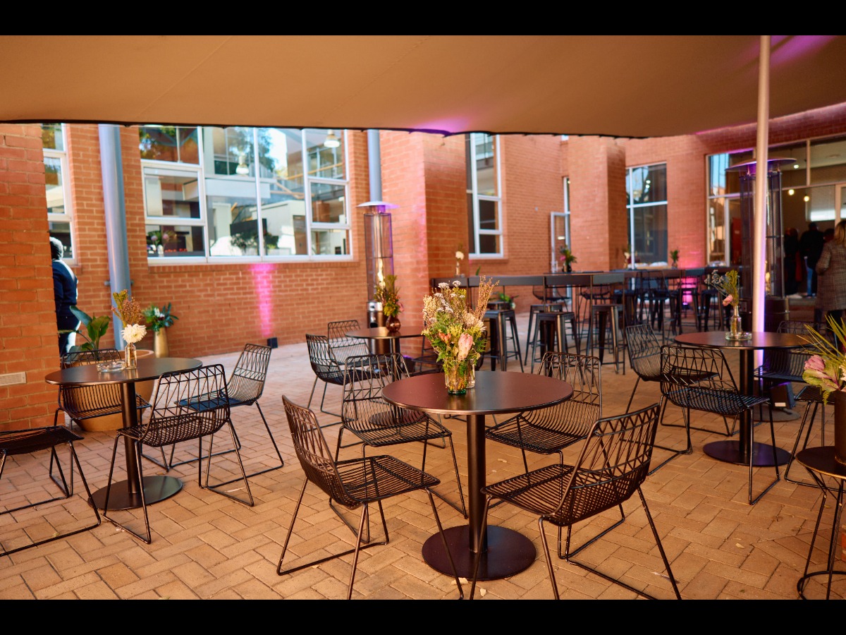 Modern cocktail table and chair layout for Cape Town networking event