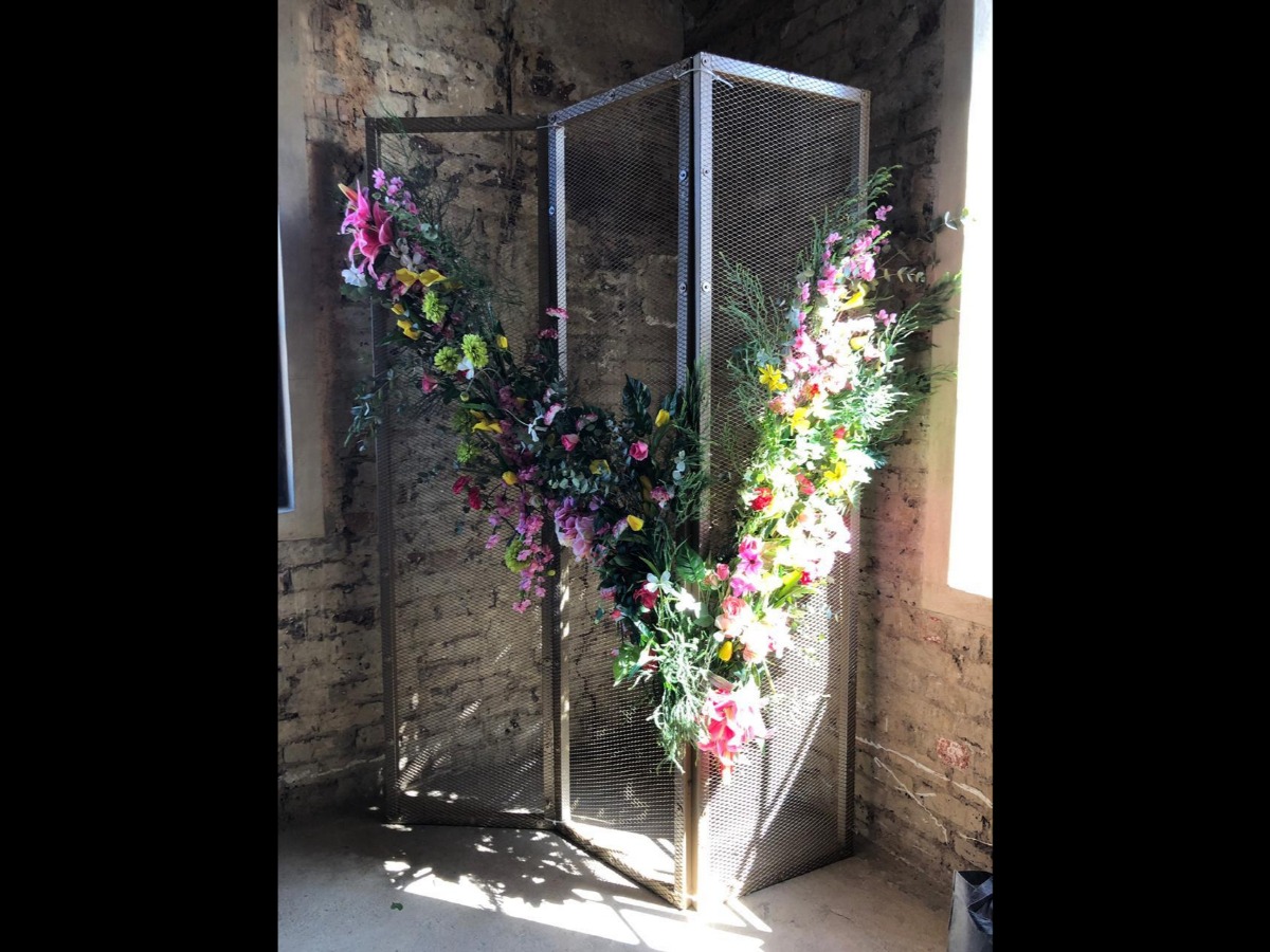 Freestanding floral V structure at industrial Cape Town venue
