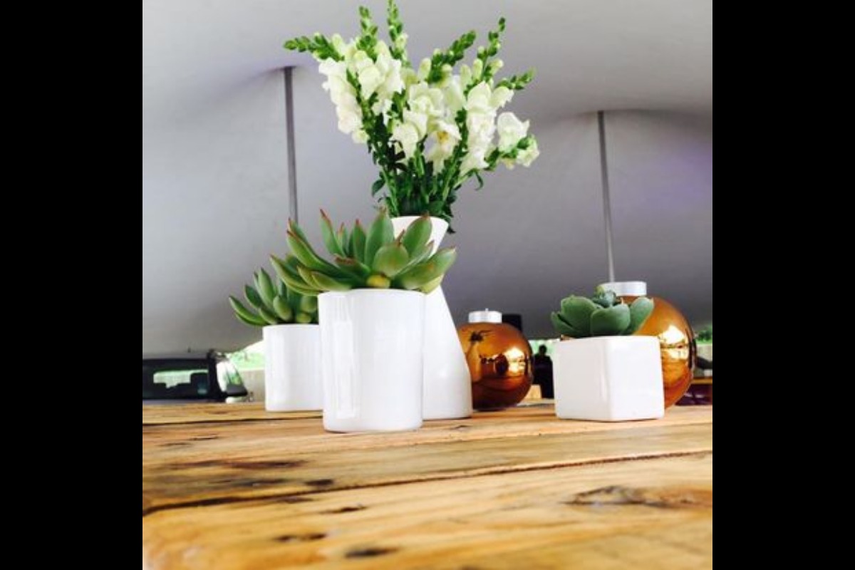 Tabletop styling with white vases and florals