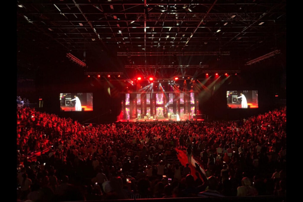 Full concert crowd with LED visuals