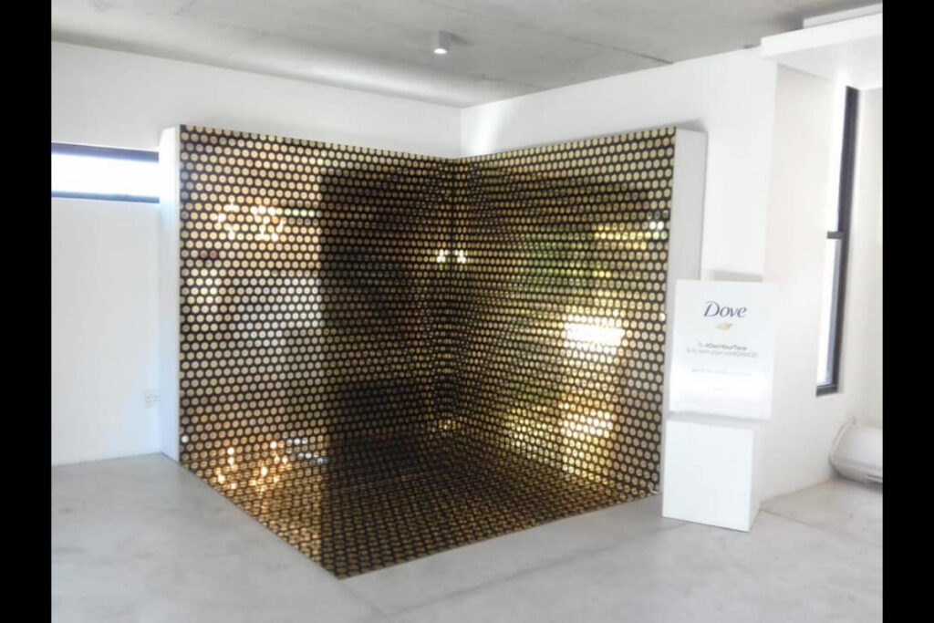 Custom black honeycomb wall display for exhibition booth in Cape Town