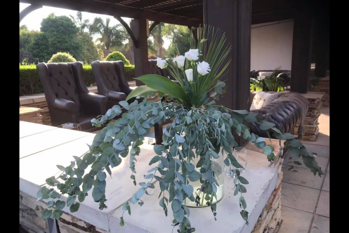 Vase overflowing with trailing greenery