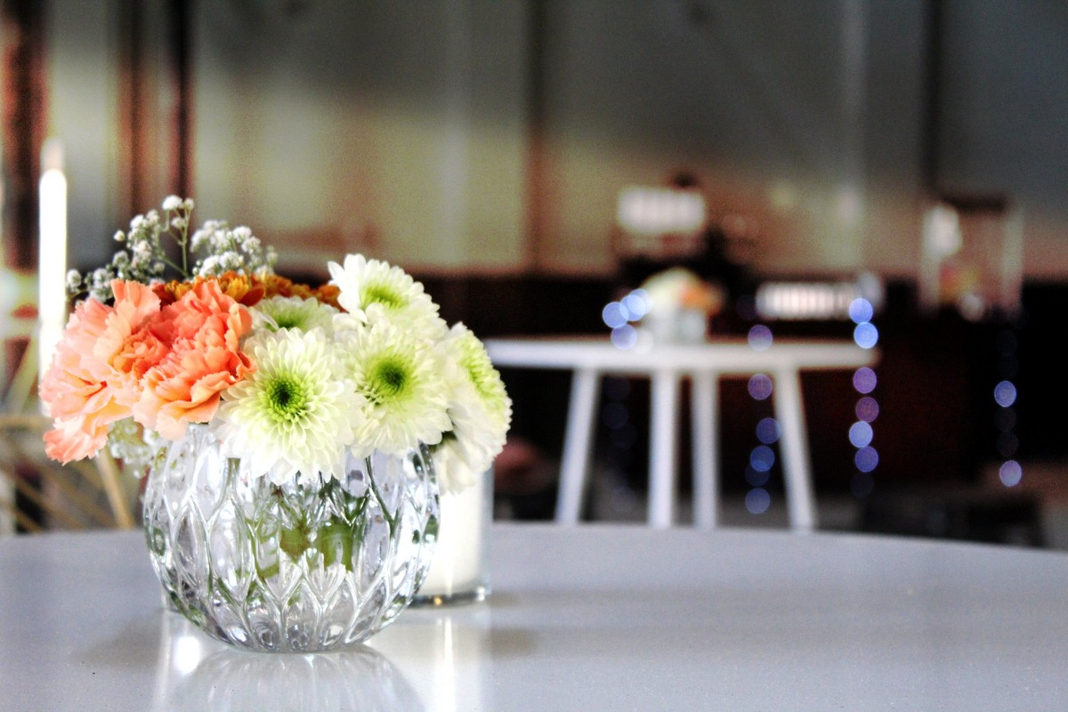 Pastel flowers in clear cut glass vase