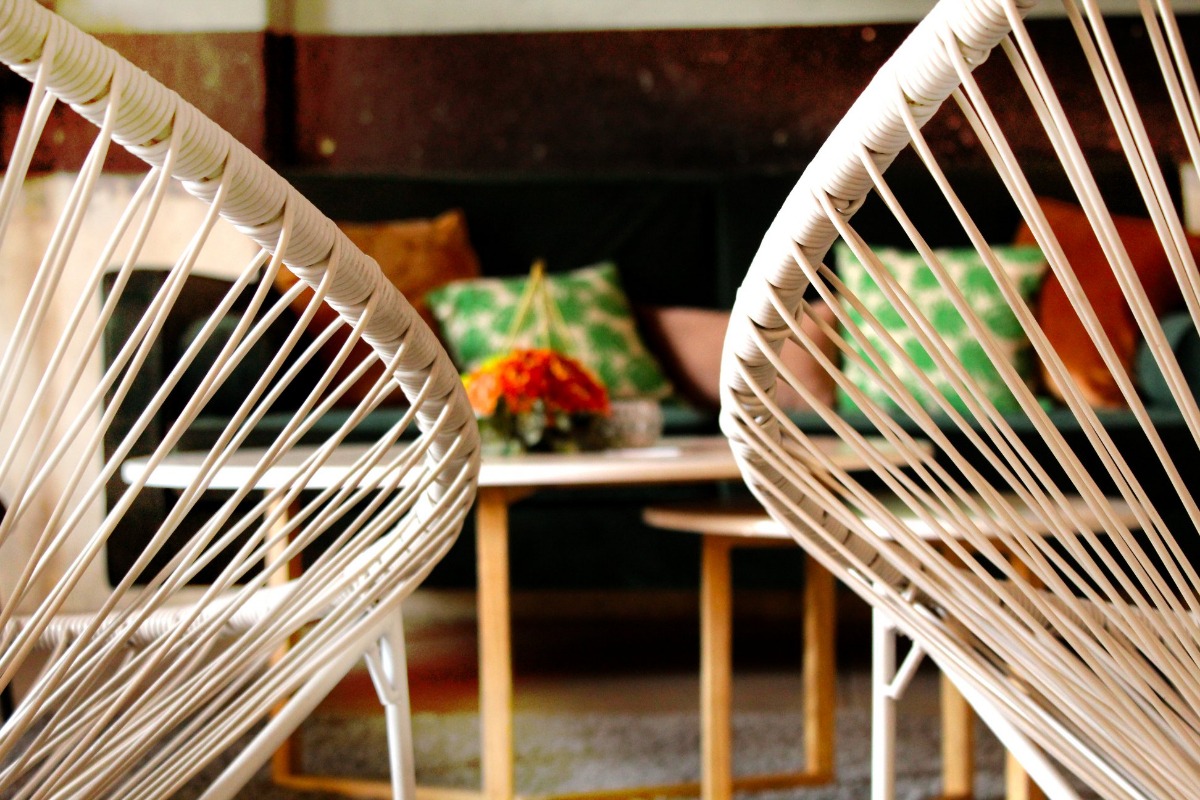 Wire event chairs with tropical pillows for casual styled seating – Cape Town