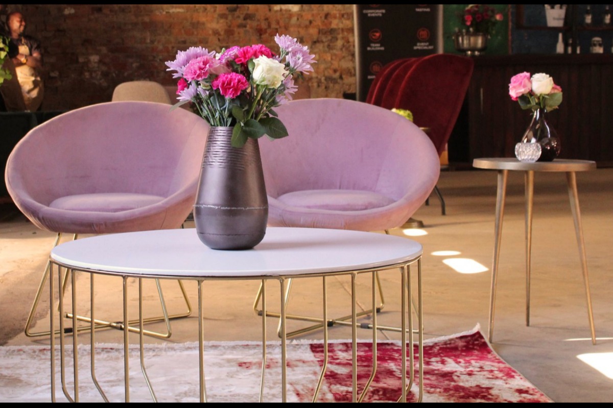 Pink velvet seating with gold tables styled for indoor lounge area – Cape Town