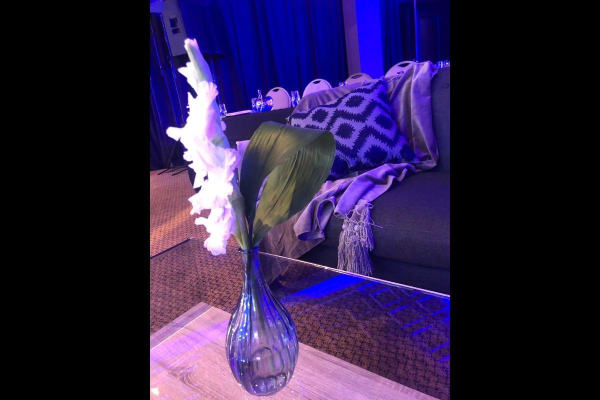 Lounge with purple LED and vase floral detail