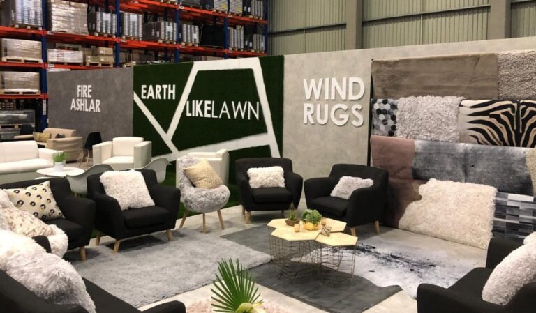 corporate lounge style exhibition stand with branded panels and seating Cape Town