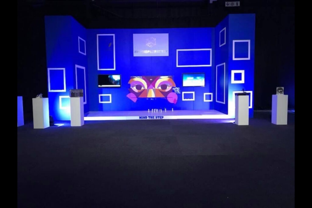 LED screen stage setup with blue digital frame elements
