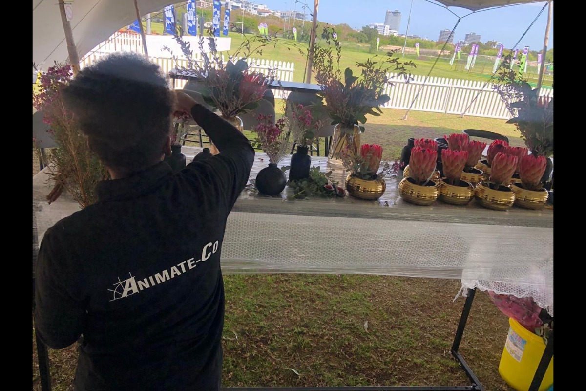 Animate-Co florist at outdoor flower setup