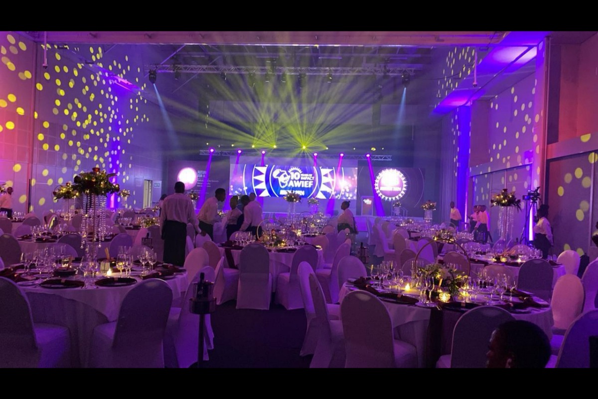 Gala dinner with stage lighting and draping for large-scale Cape Town event