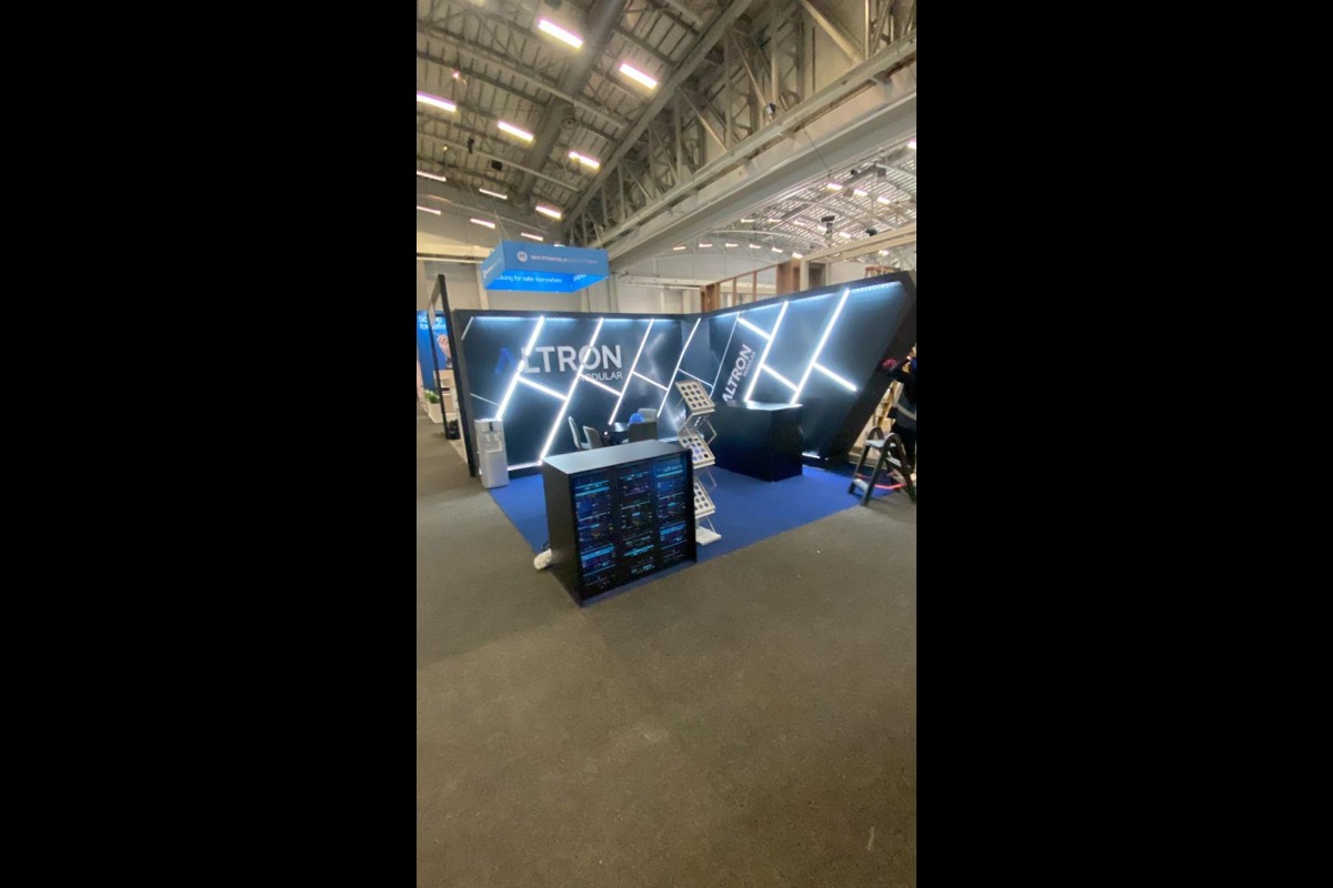 Walk-in LED trade show stand with angled light display