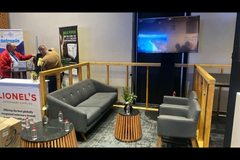 eco Expo lounge space with grey seating and display walls