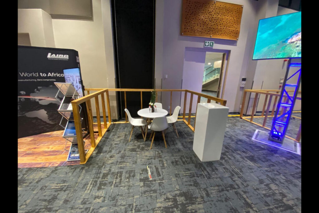 Custom-built small eco expo meeting stand with wood and white finishes